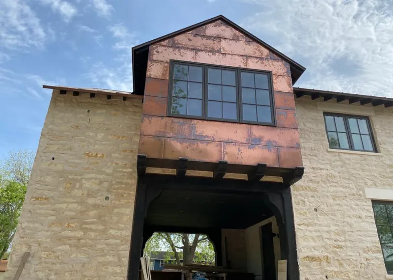 Copper metal panel facade on a stone building for Metal Roof Coating in Huber Heights
