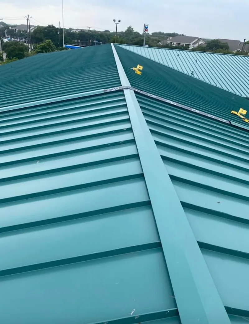 Green commercial metal roof ridge and valley for Metal Roof Repair in Huber Heights